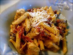 pasta with meat, cheese and sauce in a bowl