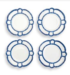 four blue and white plates sitting on top of each other