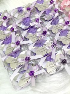 a bunch of purple and pink heart shaped tags on a white furnishing area