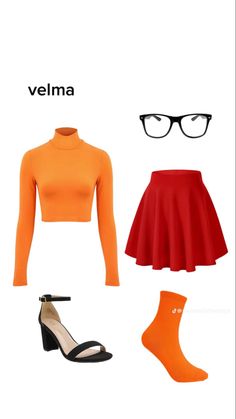 an orange top, red skirt and black shoes are arranged in the shape of a woman's head