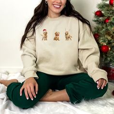 "We recommend placing your holiday orders by December 12th to ensure the best chance of delivery by Christmas! Visit our shop: https://www.etsy.com/shop/LunaAndDotDesigns Our Golden Doodle Holiday Sweatshirt showcases a charming Doodle adorned with a Santa hat, a festive bow tie, and playful reindeer antlers--making it the ultimate festive fashion statement for dog lovers. It also makes a fantastic gift for fellow Golden Doodle lovers, ensuring everyone can enjoy the festive spirit \"doodle\" style! Ideal for any situation, a unisex heavy blend crewneck sweatshirt is pure comfort. These garments are made from polyester and cotton.  The collar is ribbed knit, so it retains its shape even after washing. There are no itchy side seams on these sweaters.  .: 50% cotton, 50% polyester .: Medium- Groovy Christmas, New Years Shirts, Christmas Lovers, Cowgirl Shirts, Santa Shirts, Spirit Shirts, Festival Shirts, Sweater Christmas, Tree Shirt