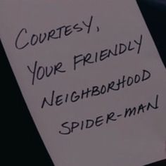 a hand holding a sign that says corres, your friendly neighborhood spider - man