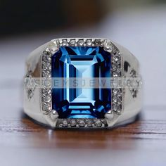 a large blue stone surrounded by white diamonds