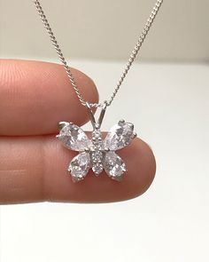 Sterling Silver Clear CZ Butterfly Necklace Metal: All components are made from solid .925 Sterling Silver Stone: Cubic Zirconia Measurement: pendant height is 18mm including bail and 17mm wide Choose Chain Length At Checkout You can find other CZ and Birthstone Jewelry in my shop here https://www.etsy.com/shop/LinksAndStones?ref=seller-platform-mcnav&section_id=24399452 Please feel free to Convo me with any questions before purchasing. Please view policy before purchasing Thank You For Visi Flower Pendant With Cubic Zirconia In Prong Setting, Flower Pendant Jewelry With Prong Setting In Cubic Zirconia, Silver Sterling Silver Necklaces With Prong Setting, Sterling Silver Necklace With Prong Setting, Silver Sterling Necklace With Prong Setting, Silver Sterling Silver Necklace With Prong Setting, Cubic Zirconia Gemstone Flower Pendant Jewelry, Silver Crystal Flower Pendant Jewelry, Diamond White Sterling Silver Flower Pendant Jewelry