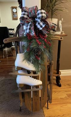 a wooden sled with christmas decorations on top of it in the middle of a living room