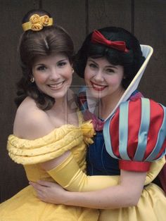 two women dressed as snow white hugging each other