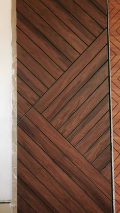 a close up of a door with wood panels on the outside and in the inside