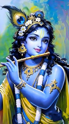 the hindu god is playing flute with his hands and body painted in blue, gold and white