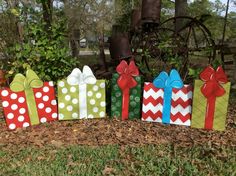 several colorful wrapped presents sitting in the grass