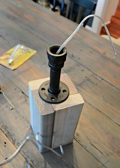 an electrical device sitting on top of a wooden table