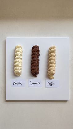 four different types of chocolates on display in a white frame with words vanilla, chocolate and coffee