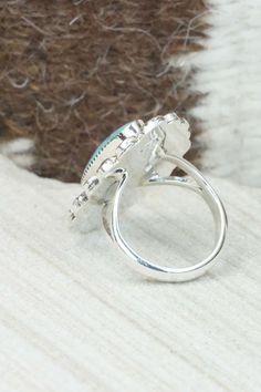 This turquoise & sterling silver ring was made by Navajo silversmith Fernando Smith. The back is signed RB and stamped .925.Size: 5Length: 1 1/4"Width: 7/8"Free shipping on all orders! We ship with USPS and always include tracking. All orders ship within a day of payment.Returns are accepted up to 30 days after you receive your order. Just send us a message. Our shop offers cash back or store credit. The item must be returned in new condition. Sterling Silver Turquoise Rings With Concho Detail, Sterling Silver Turquoise Concho Ring, Southwestern Turquoise Rings Stamped 925, Silver Oval Turquoise Ring With Concho, Silver Oval Turquoise Ring With Concho Detail, Southwestern Sterling Silver Opal Ring, Southwestern Silver Turquoise Ring With Concho, Southwestern Style Stamped 925 Turquoise Ring, Southwestern Style Turquoise Ring Stamped 925