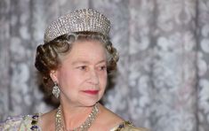 an older woman wearing a tiara and diamond necklace