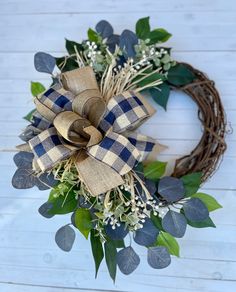 a wreath with blue and white flowers on it