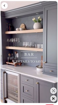 a kitchen with gray cabinets and glassware on the shelves, which are labeled bar details to save