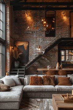 a living room filled with lots of furniture next to a brick wall covered in lights