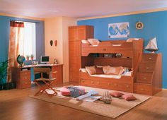 a bedroom with blue walls and wooden furniture