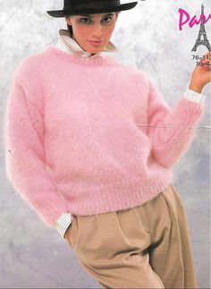 a woman wearing a pink sweater and hat