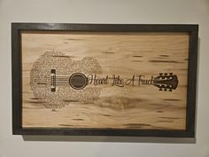 a wooden plaque with the words, i heard the blues and guitar on it