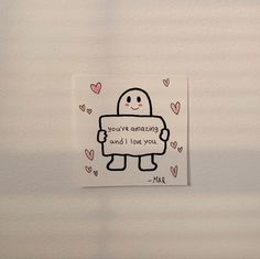 a piece of paper with an image of a robot holding a sign that says, you're amazing and i love you