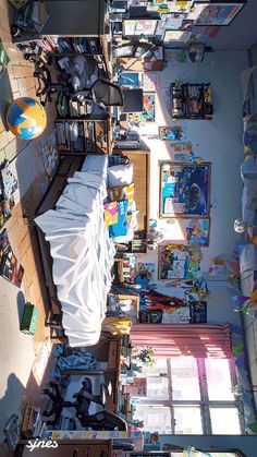 an overhead view of a bedroom with lots of toys and books on the floor,