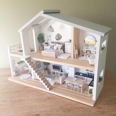 a doll house with furniture and accessories in it