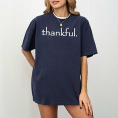 Thankful Shirt, Thanksgiving Day Shirt, Fall T-shirt, Family Shirt, Comfort Colors, Inspirational Thankful Tee, Aesthetic Tee UNISEX Comfort Colors® Brand T-Shirt. -----How To Order----- 1-) Please, check and review all photos. 2-) Choose your t-shirt size and color. 3-) Click add to cart. You can go back to add more product. 4-)Click "Proceed to check out". 5-)When you check out, you can add a note to seller for any request. ---------- Product ---------- * 6.1 oz./yd² (US), 10 oz/L yd (CA), 100 Trendy Blue T-shirt For Fall, Crew Neck T-shirt With Letter Print For Loungewear, Loungewear Crew Neck T-shirt With Letter Print, Relaxed Fit Crew Neck Tops With Text Print, Oversized Blue T-shirt With Slogan, Relaxed Fit Crew Neck Top With Letter Print, Fall Relaxed Fit Short Sleeve Tops, Relaxed Fit Short Sleeve Tops For Fall, Oversized Pre-shrunk Crew Neck Shirt