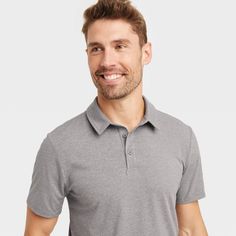 Why we're ALL IN: This jersey polo tee helps create a cool, sporty look. Designed with soft and stretchy fabric, this lightweight T-shirt offer flexible comfort, and the collared neckline with 3-button closure makes for ease of wear. Plus, the below-waist length and solid hue allows for easy pairing with a variety of bottoms. All in Motion™: Made for every move, priced for every day. Casual Short Sleeve Moisture-wicking Polo Shirt, Casual Moisture-wicking Short Sleeve Polo Shirt, Sporty Collared T-shirt, Gray Cotton Polo Shirt For Sports, Casual Stretch Polo Collar T-shirt, Relaxed Fit Collared Sports Top, Gray Short Sleeve Sports Polo Shirt, Gray Short Sleeve Polo Shirt For Sports, Casual Collared Golf T-shirt