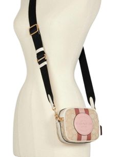 Signature jacquard and refined pebble leatherTwo credit card slotsZip closure, fabric liningOutside open pocketDetachable strap with 24" drop for shoulder or crossbody wear5 1/2" (L) x 4 1/2" (H) x 2 1/2" (W)Style No. 7057Color: Khaki Powder Pink Multi Coach Dreamer Bag, Pink Coach Crossbody Bag, Coach Pink Crossbody Bag, Multicolor Coach Bag With Zipper Closure, Pink Coach Shoulder Bag With Gold-tone Hardware, Pink Coach Bag With Zipper Closure, Powder Pink, Camera Bag, Credit Card