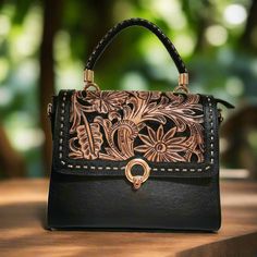 Featuring a gorgeous chiseled artisan design, this rustic  Hand Tooled Leather Bag will help you bring a little vintage flair to your everyday outfit. The perfect size for fitting all of your everyday essentials, this purse was actually handmade with love and care  with help of talented  artisans . height: 23cm. 9 inches width : 28cm.  11inches  base: 12cm.    4.5  inches  Adjustable and detachable large strap:125 cm  49 inches Fabric lining Zipper at the top interior: 1 zippered compartment. ex Vintage Top Handle Shoulder Bag With Hand Tooled Detail, Vintage Top Handle Shoulder Bag With Hand Tooling, Vintage Engraved Satchel Bag, Vintage Hand Tooled Top Handle Shoulder Bag, Engraved Satchel Bag For Daily Use, Vintage Engraved Bags For Everyday Use, Engraved Satchel For Daily Use, Vintage Hand Tooled Top Handle Bag, Daily Use Engraved Satchel Bag