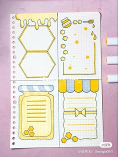 an open notebook with yellow stickers on it and some writing paper next to it