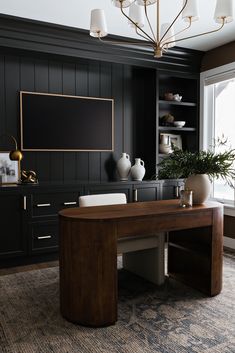 a large wooden desk sitting in the middle of a room