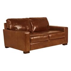 a brown leather couch sitting on top of a white floor