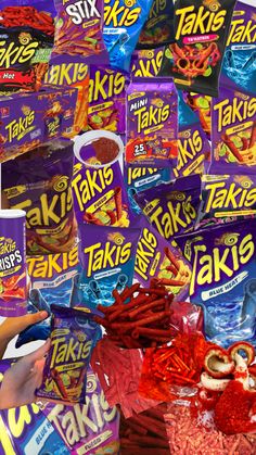 a pile of assorted snacks sitting on top of a table next to each other