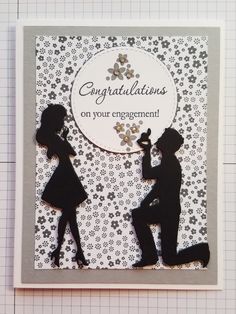 congratulations card with silhouettes of two people holding each other's hand and the words congratulations on their engagement