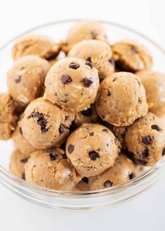 a glass bowl filled with chocolate chip cookies