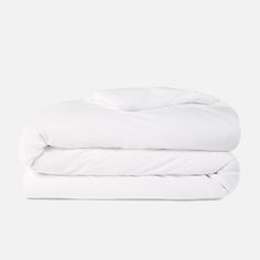 two white pillows stacked on top of each other