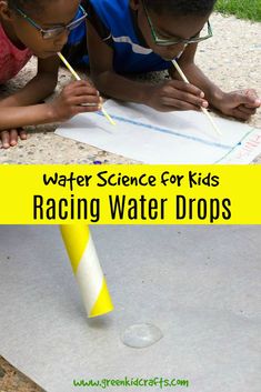 two young boys are drawing on paper with pencils while the boy looks at it