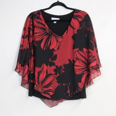 Details Elevate Your Wardrobe With This Stunning Northstyle Women's Blouse, Featuring A Captivating Red And Black Floral Design. The Asymmetrical Chiffon Overlay Creates A Graceful, Flowing Silhouette That's Both Elegant And Eye-Catching. Crafted From 100% Polyester Shell With A 96% Polyester And 4% Spandex Contrast, This Blouse Offers Comfort And Style In Equal Measure. Tags Removed, But Never Worn. The Bold Butterfly Print Adds A Touch Of Whimsy, While The V-Neckline And Flutter Sleeves Provid Red Chiffon V-neck Blouse, Red Chic Chiffon Blouse, Chic Red Chiffon Blouse, Chic Red Chiffon Top, Elegant Red Chiffon Tops, Black Chiffon Formal Tops, Black Chiffon Blouse For Formal Occasions, Formal Black Chiffon Blouse, Summer Red Chiffon Blouse