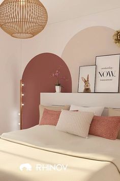 a bedroom with pink walls and white bedding