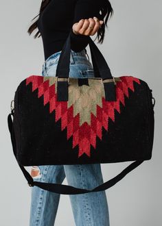 Our newest Aztec inspired print is here, and you'll want to get this one before it's gone! This black, green and red  Aztec inspired duffel bag is perfect for your fall getaways this season.  Black, green and red inspired Aztec duffel Zipper closure with interior zipper and 2 small open pockets Removable strap Measures 19" x 9" x 11" Designed in the U.S.A Produced in India.  100% Cotton Lining: 100% Polyester Blouses Vintage, Flannel Sweatshirt, Fall Getaways, Knit Jewelry, Deco Originale, Bag Travel, Vintage Sweatshirt