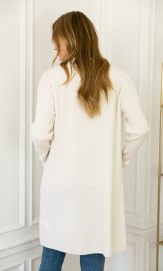 FREE US SHIPPING, FREE RETURNS This timeless and versatile cashmere cardigan is the perfect layering piece. Divinely soft and cozy cashmere texture with beautiful rib knit detailing, you can easily dress her up and down for effortless elegant lounging, power meetings and anything in between. Full-length coverage. Hits just above the knee. Sleek seamless design with double pockets. Elegant rib knit detailing. FIT: Choose your usual size for an elevated, classic fit. Size up if you're looking for Knee Length Cardigan, Color Whisper, Grey Sapphire, On The Plane, Cashmere Wrap, Wrap Coat, Wrap Cardigan, Cashmere Cardigan, Open Cardigan