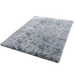 a gray area rug on a white background with no one in it or someone else