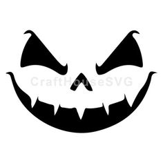 a black and white halloween pumpkin face with fangs on it's mouth, which is drawn