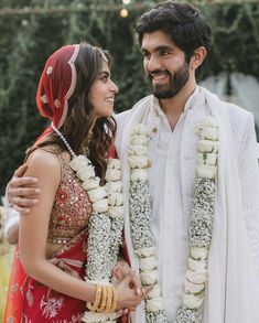 a man and woman standing next to each other