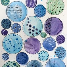 an art project made with watercolors and ink, depicting different types of circles