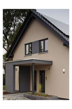 an image of a house that has solar panels on the roof and windows in it