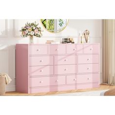 a pink dresser with drawers in a room