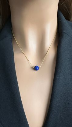 Add a touch of elegance to your outfit with this Lapis Lazuli Necklace. This beautiful necklace is made with genuine lapis lazuli stones that are known for their deep blue color and natural beauty. The stones are carefully hand-selected and set on sterling silver or gold chain to create a stunning piece of jewelry that will be cherished for years to come. Pendant: AAA Quality Natural Lapis Lazuli 8mm or 5mm bead Chain: 17.5 inches 925 Sterling Silver Box Chain or Gold Plated chain over sterling Lapis Lazuli Blue, Deep Blue Color, Lapis Lazuli Jewelry, Lapis Lazuli Pendant, Lapis Lazuli Necklace, Lapis Lazuli Stone, Bead Chain, Silver Box, September Birthstone