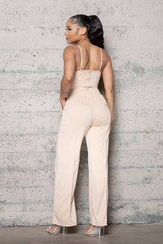 This Beige Two Piece Set includes a bodysuit with adjustable straps, padded bust, zipper at back, and clasps at crotch. Wide legged pants with pockets, and stretch waist adjustable pull string with gold accents. Los Angeles Street, Bustier Bodysuit, Wide Legged Pants, Spaghetti Strap Top, Pants With Pockets, Bustier Top, Nude Color, Strap Tops, High Waisted Trousers